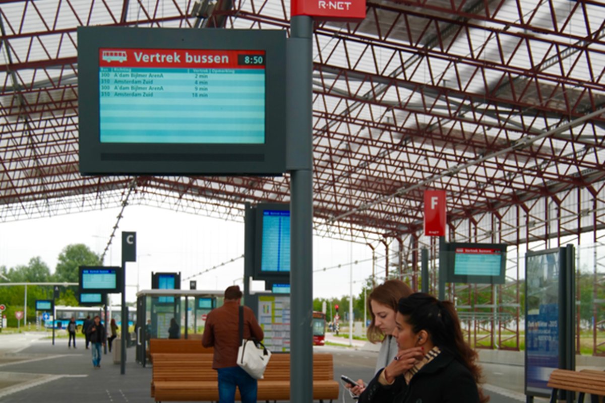 Customised outdoor departure display at an airport bus shelter